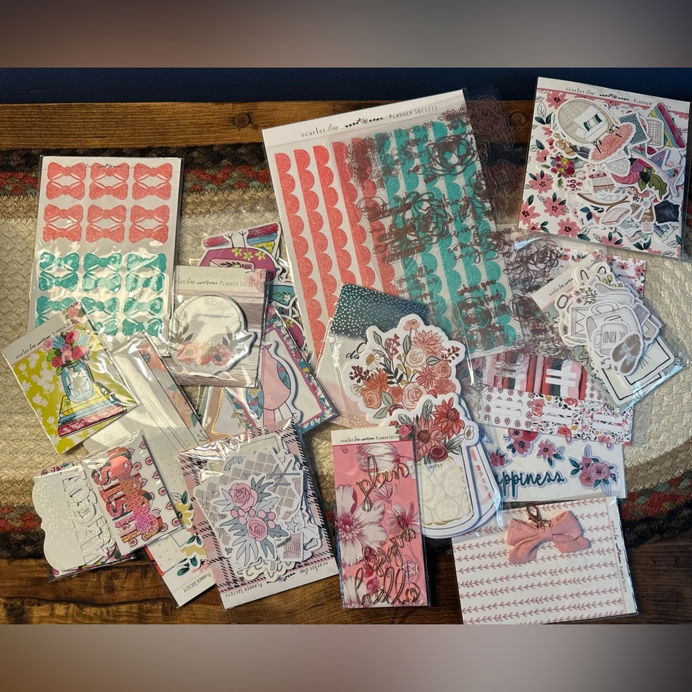 Collection of various old TPS planner society kit items.
